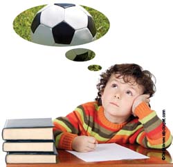 Boy dreaming of football Boy dreaming of football