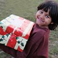 Child in Romania receiving gifts