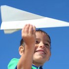 Boy and paper plane
