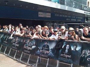 Handing out copies of The Hunger Games in the queue at the UK premiere of Eclipse. Handing out copies of The Hunger Games in the queue at the UK premiere of Eclipse.