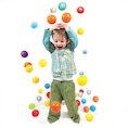 Boy with brightly coloured balls