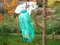 Plastic milk carton bird feeder Plastic milk carton bird feeder
