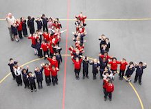 School children stood in a formation to create the number '34'