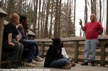 Children having a nature talk in the woods