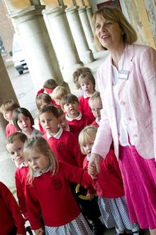 reception teacher with class on school trip
