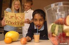 Three primary school children taking part in the smoothie challenge