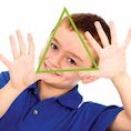 boy holding triangle