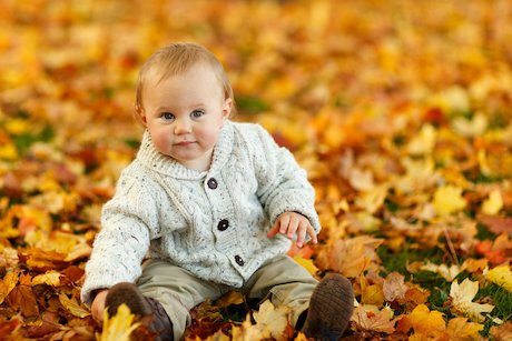 baby playing with leaves outside baby playing with leaves outside