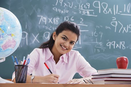 Teacher writing a report