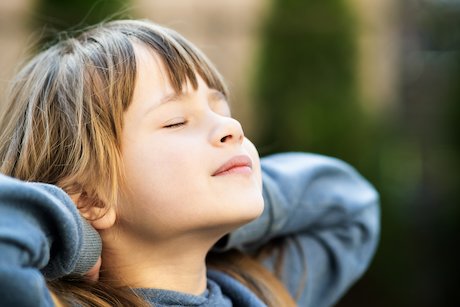 A young girl meditating A young girl meditating