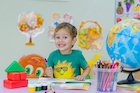 Smiling child in classroom/nursery