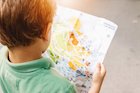 Young boy looking at a map
