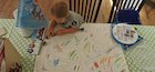 Child drawing a map of a story