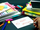 The word apple written in English and Ukrainian on a flashcard
