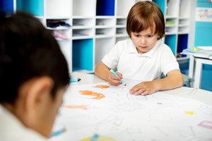 child in classroom doing an art project child in classroom doing an art project