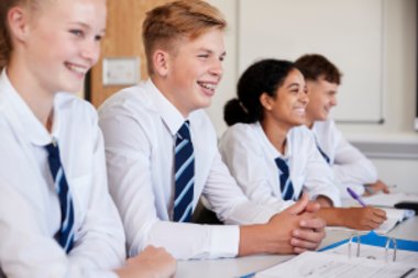 A group of students at their desks in a classroom.